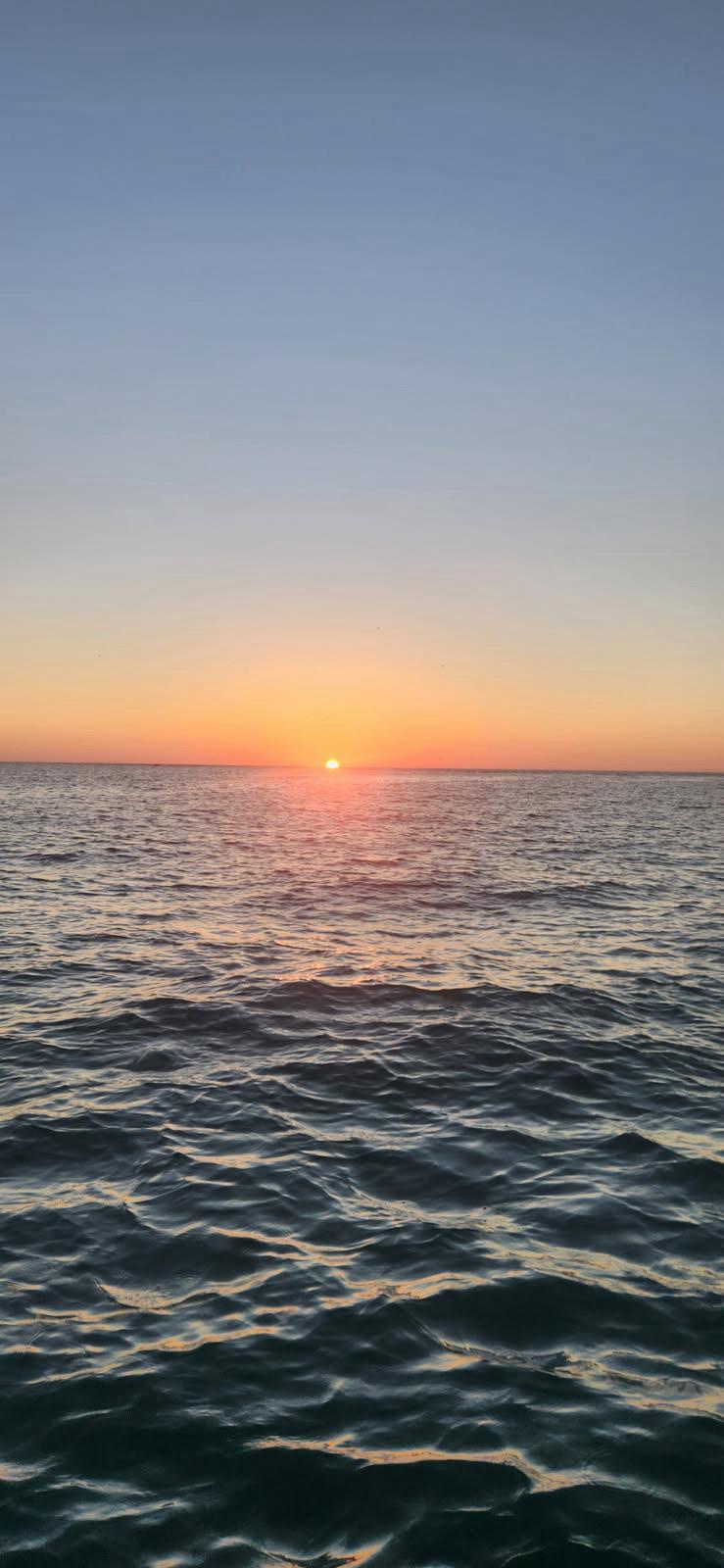 Sunset over Sarasota water during a private cruise